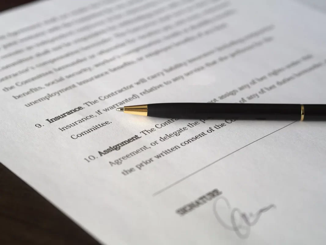 Close-up of a trust deed document highlighting the insurance assignment clause necessary for setting up an insurance trust.