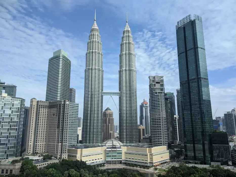 The kuala lumpur city skyline featuring the petronas twin towers, representing the high-value real estate market and property inheritance in malaysia.